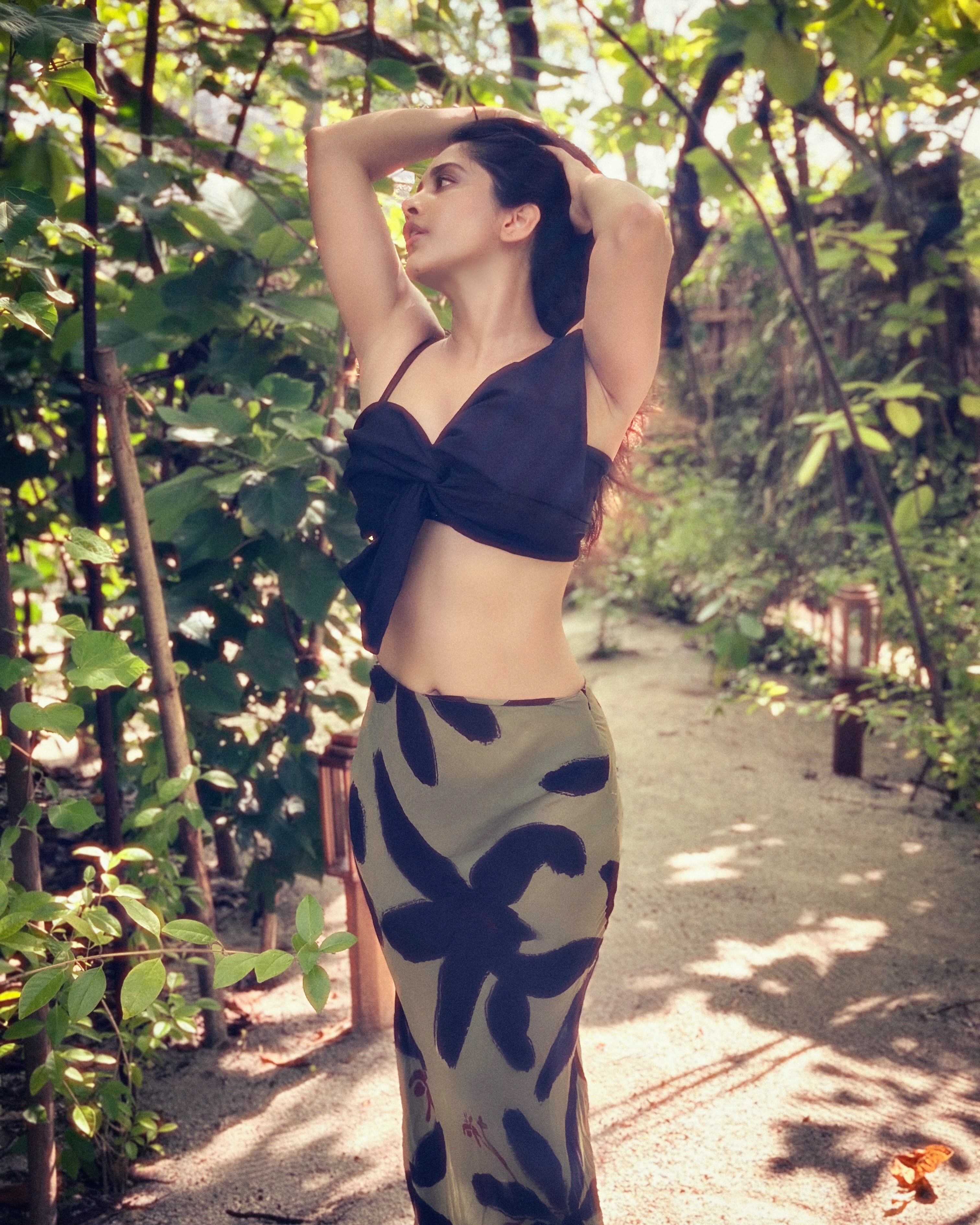 Nabha Natesh Strikes A Sunlit Pose Amid Greens!!