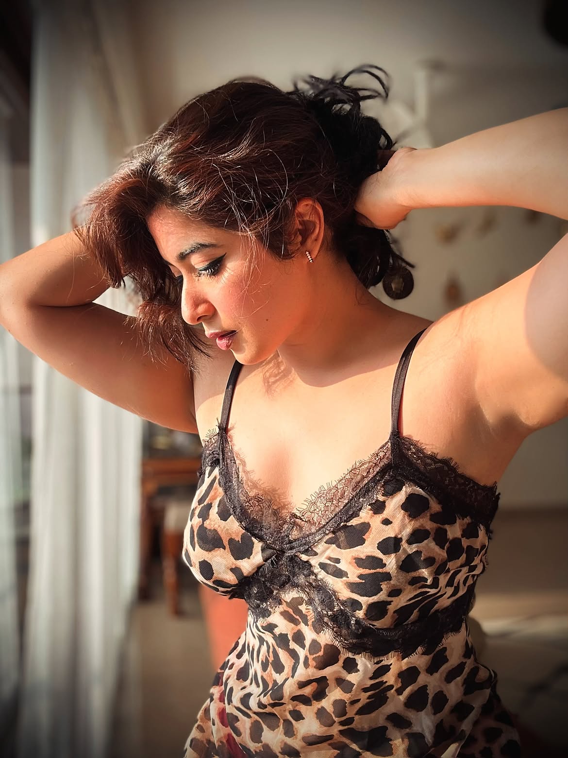 Nikita Sharma Poses In A Leopard Print Slip Gown