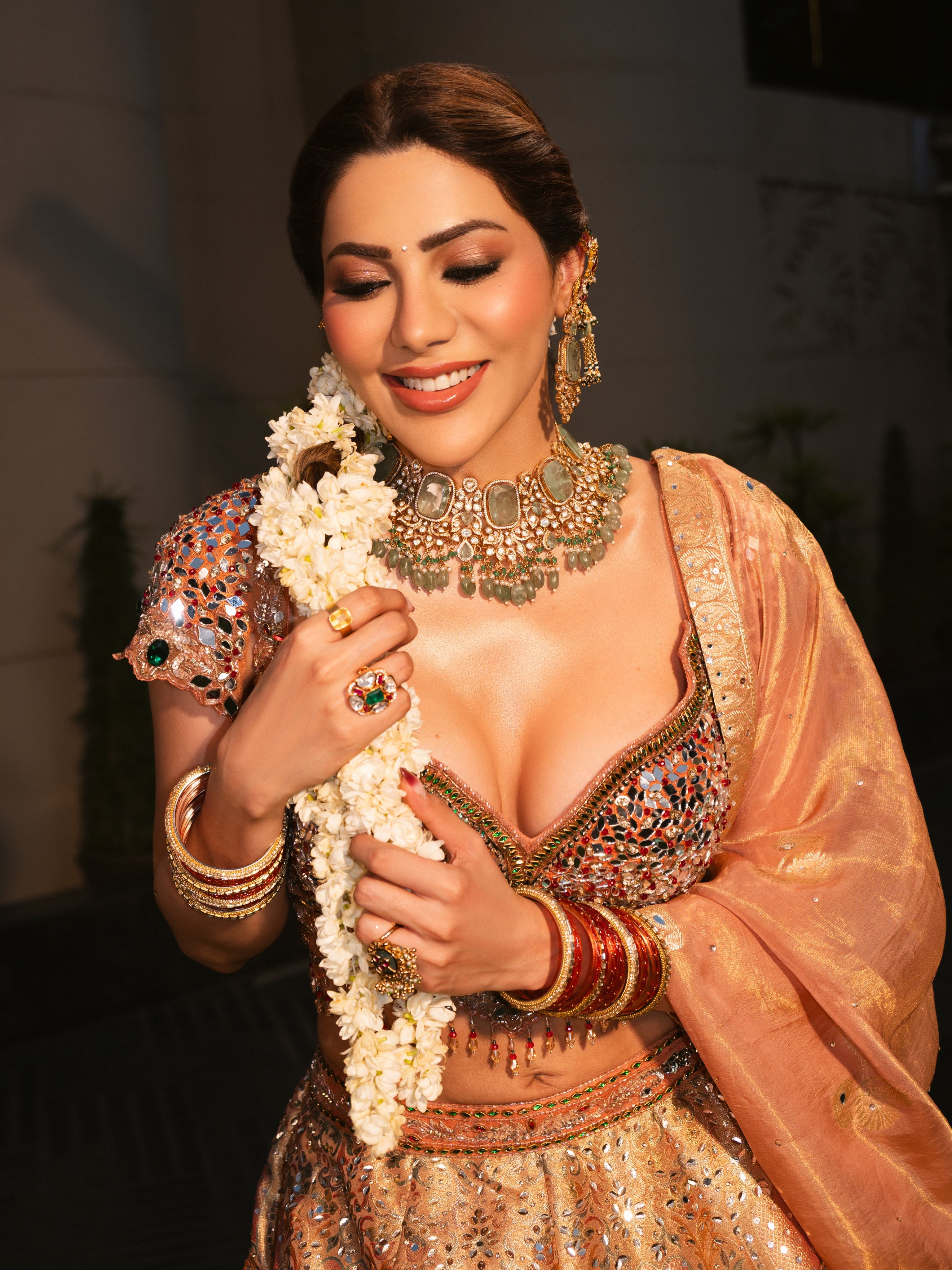 Nikki Tamboli Holds White Jasmine Flower Garland