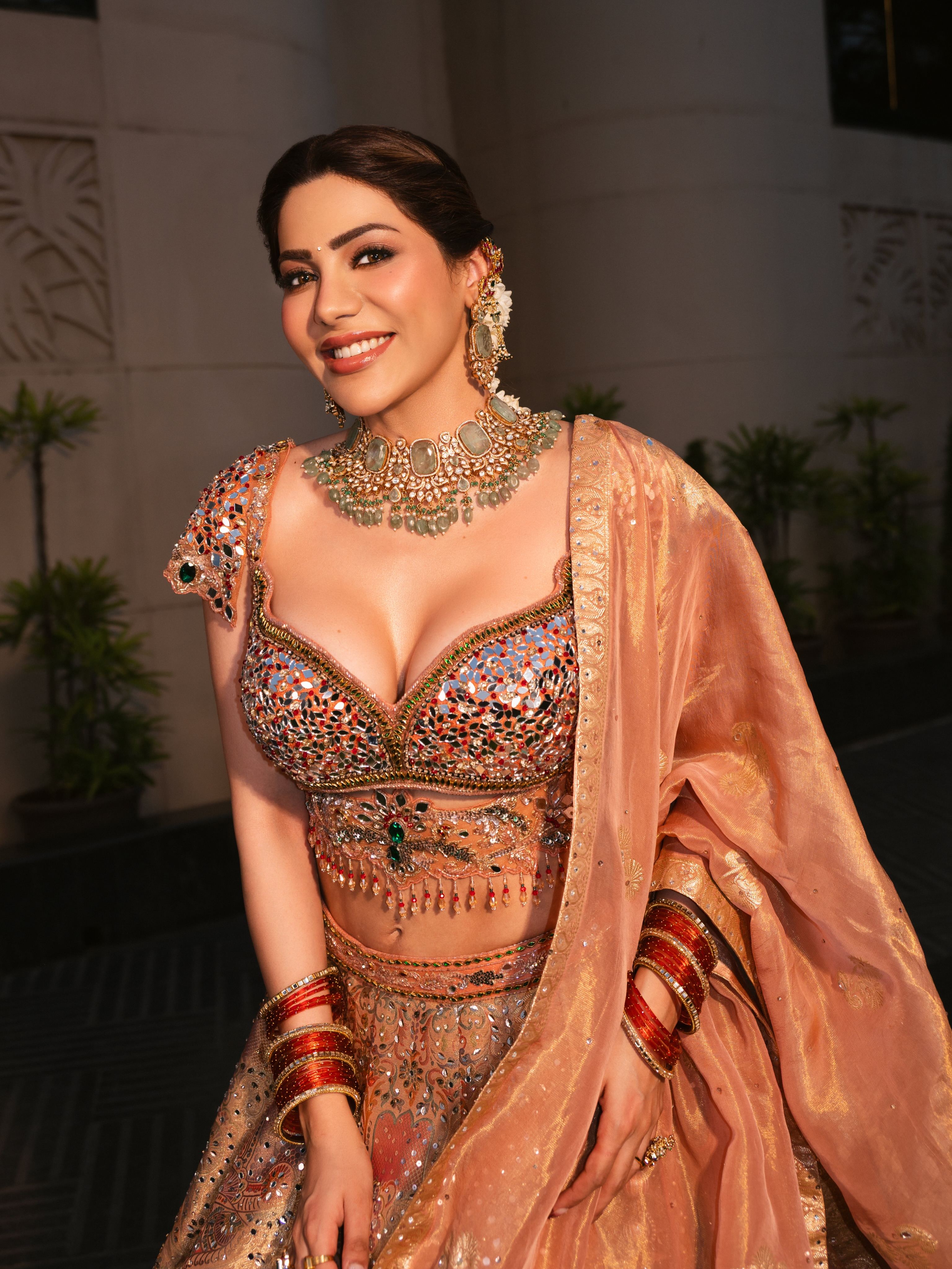 Nikki Tamboli Shows Peach Dupatta With Gold Trim