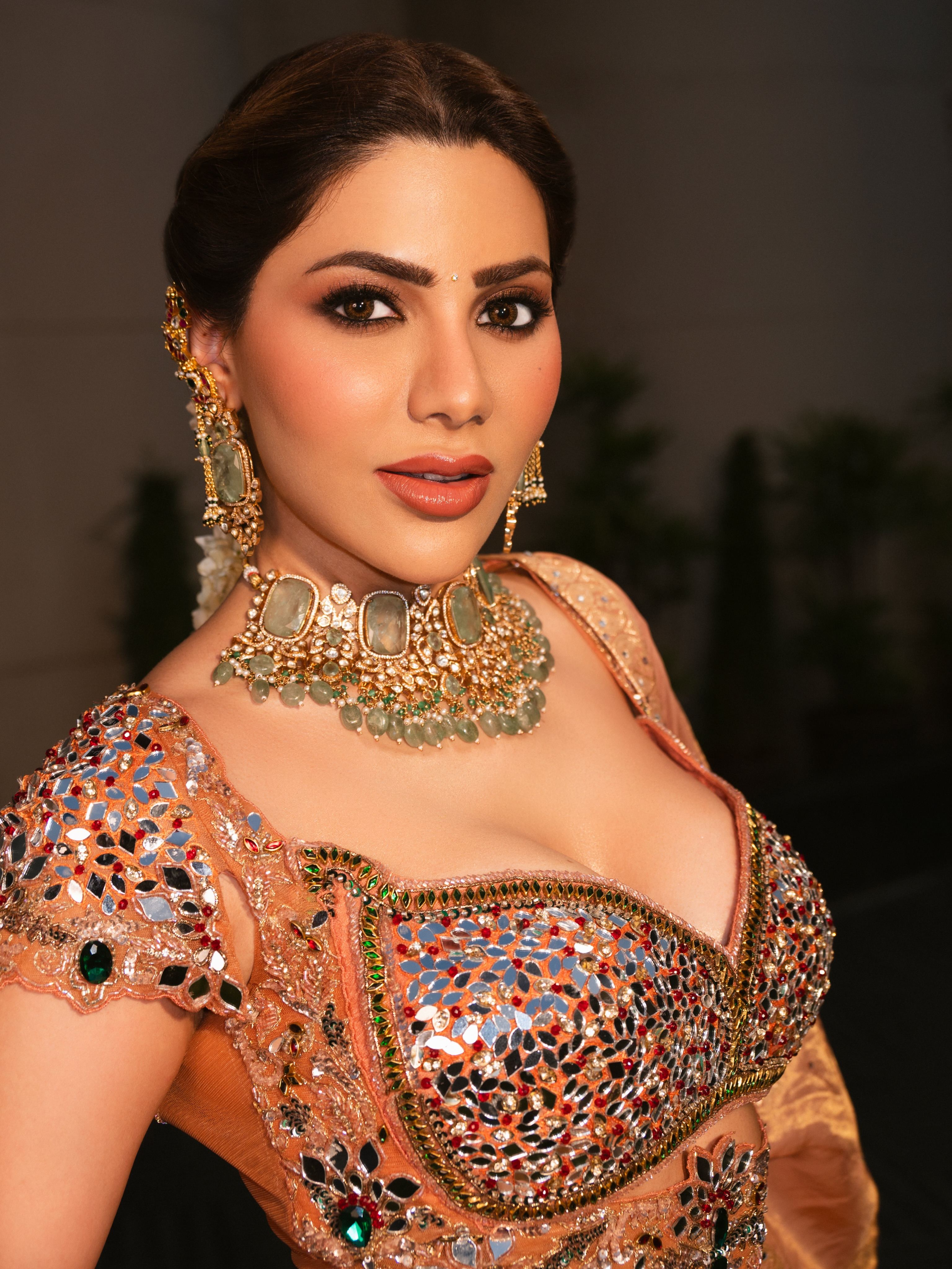 Nikki Tamboli Wears An Ornate Green Stone Choker