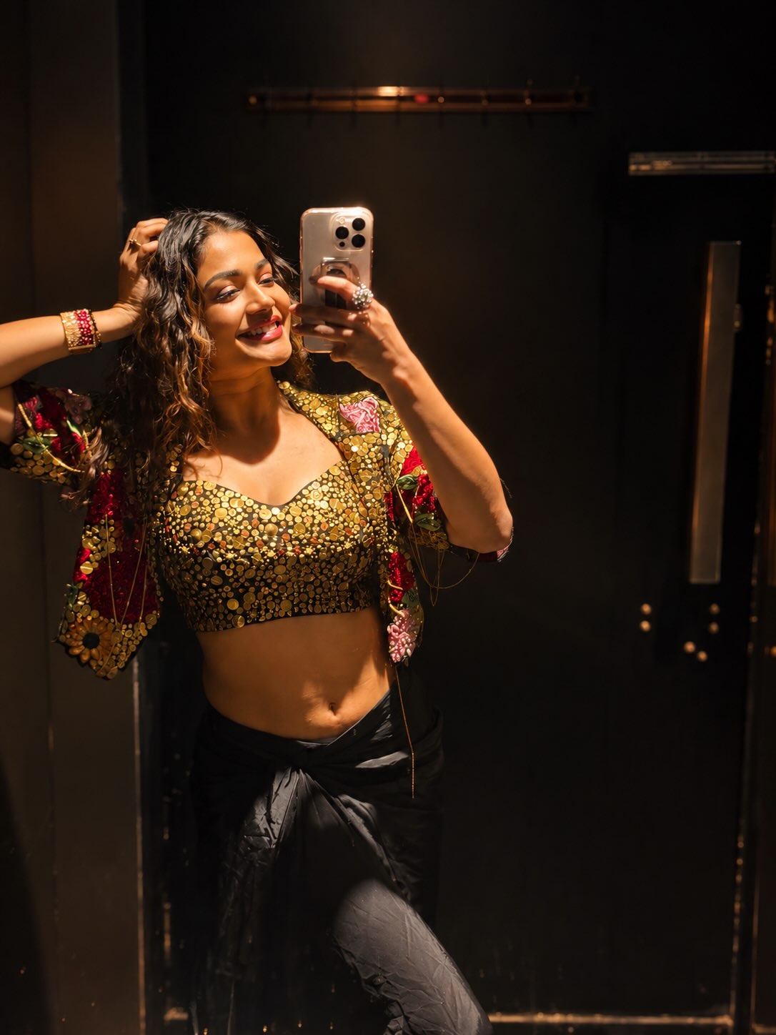 Payal Adjusts Wavy Locks During A Mirror Selfie!