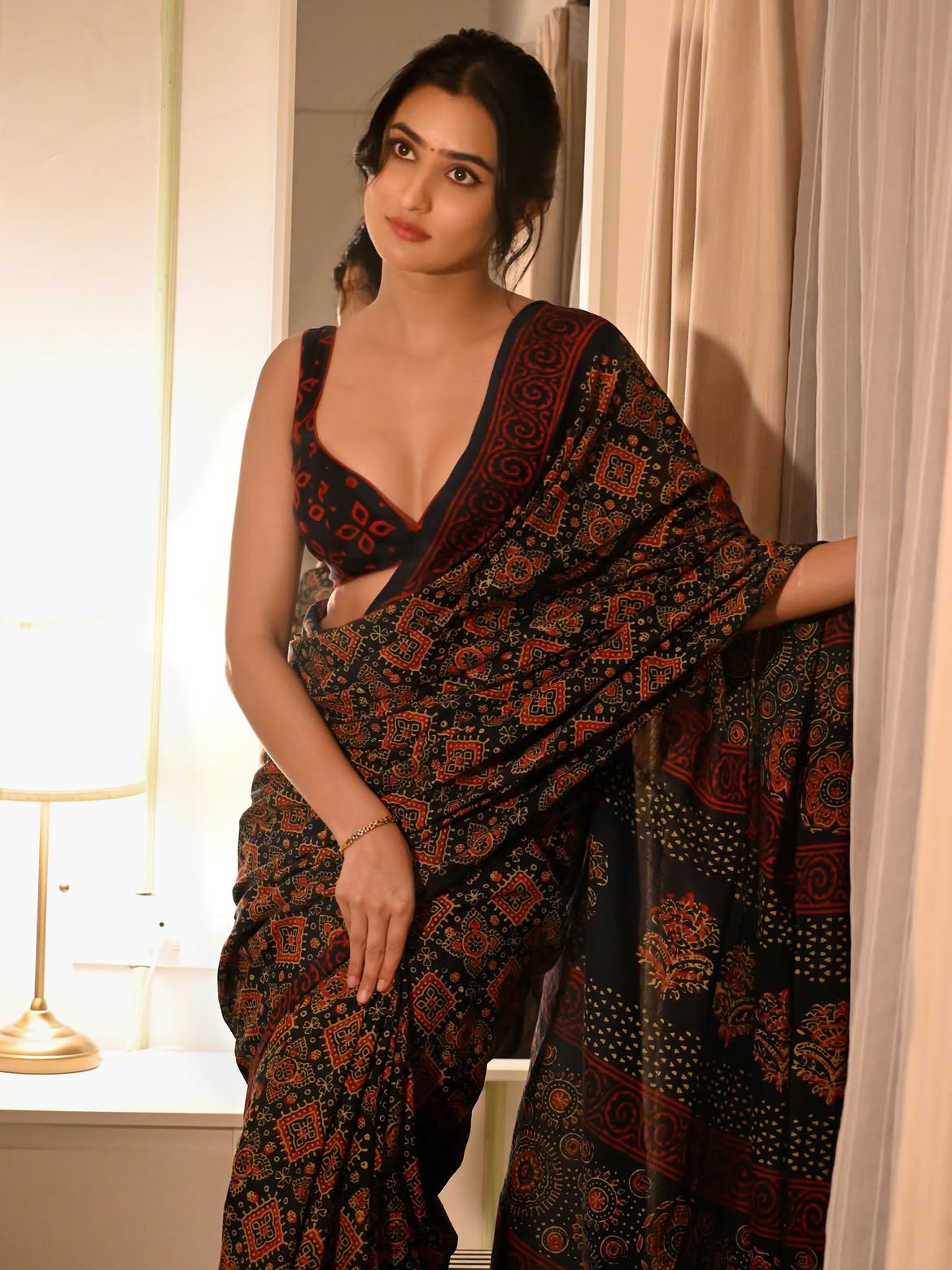 Sanchi Rai Poses By Curtains In Black Saree Look