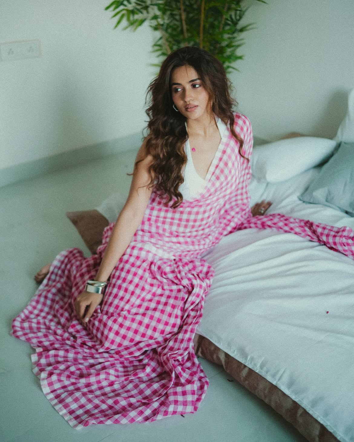 Teju Ashwini Sits Beside A Bed In A Pink Saree!!