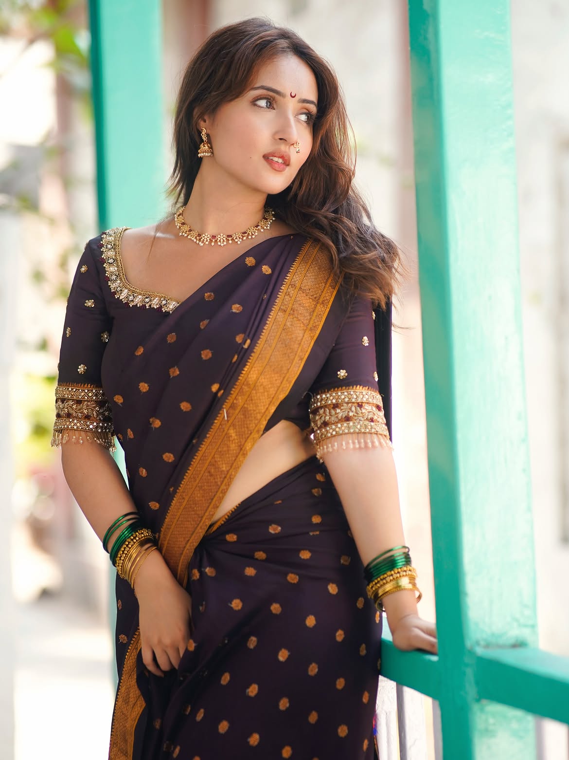 Varsha Rekhate Adds Gold Glam To Her Dark Saree!