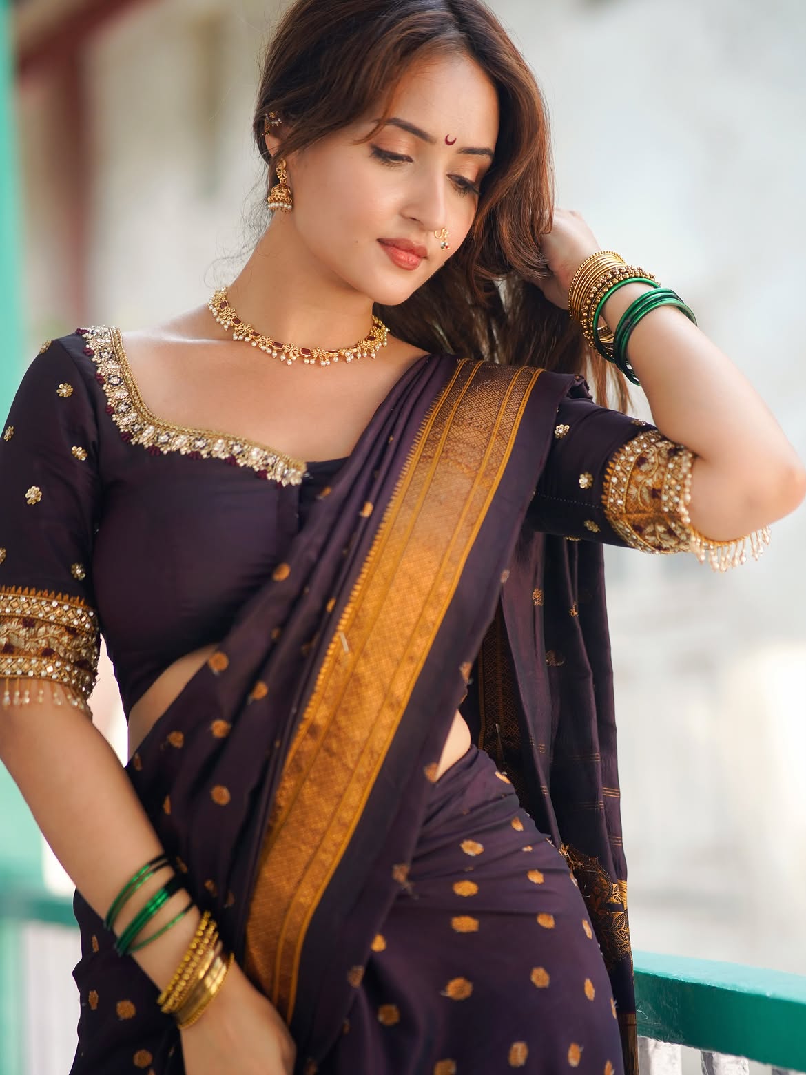 Varsha Rekhate Poses With Green Bangles In Saree