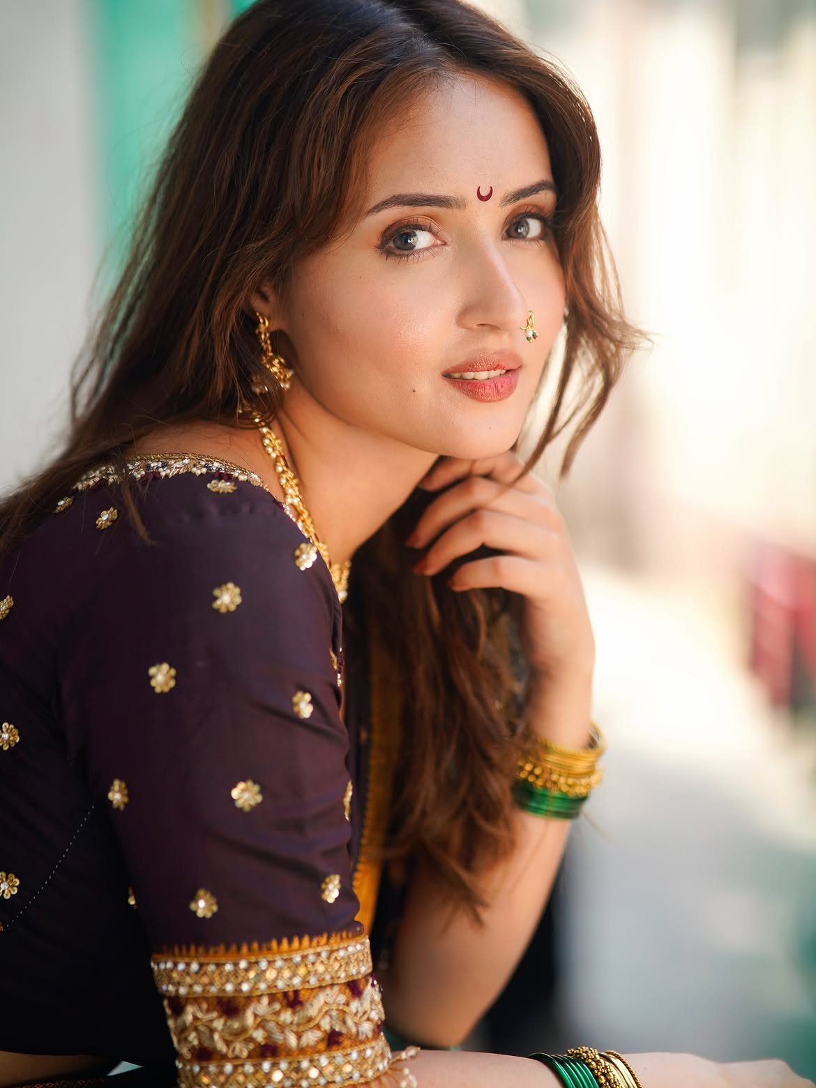 Varsha Rekhate Strikes A Bold Pose In Dark Saree