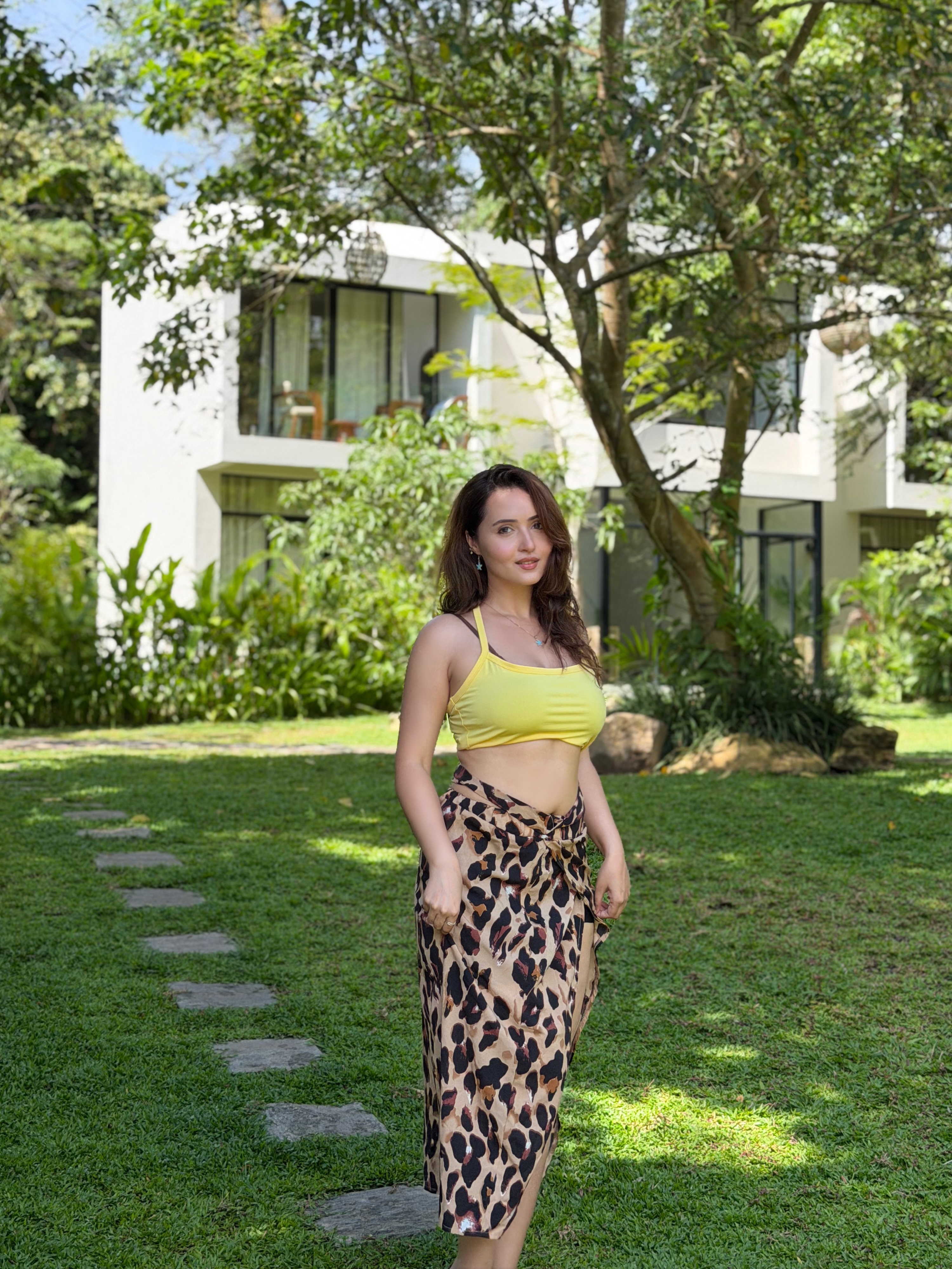 Varsha Rekhate Smiles Beside A Blue Resort Pool!